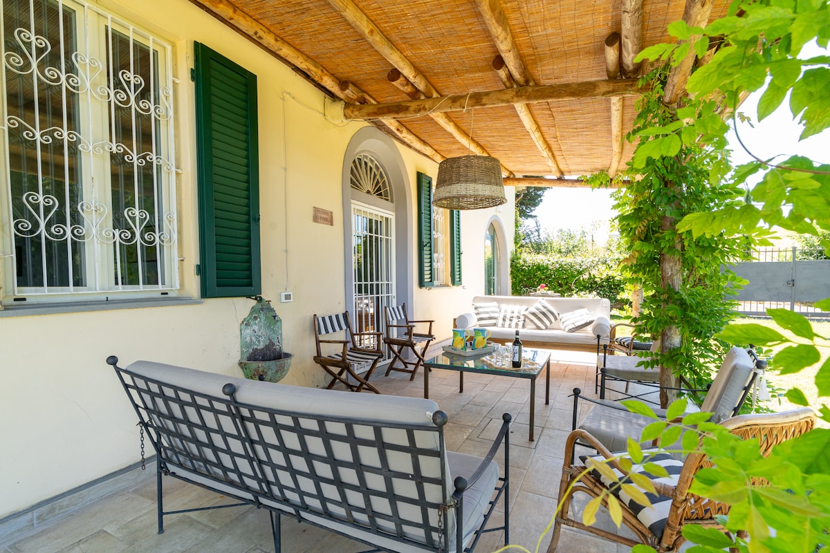 The covered loggia with a long table